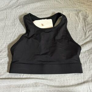 Fabletics lightly padded black sport bra with pocket on back